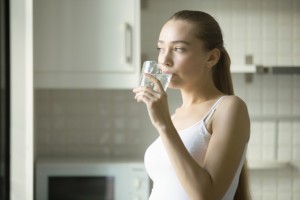 young-girl-drinking-hot-water